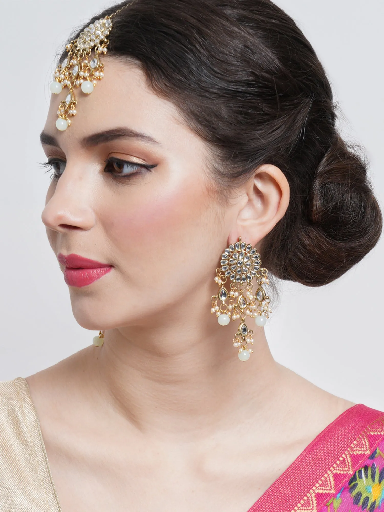 Gold Plated Embellished Light Green Kundan Tassel Earrings with Maangtikka