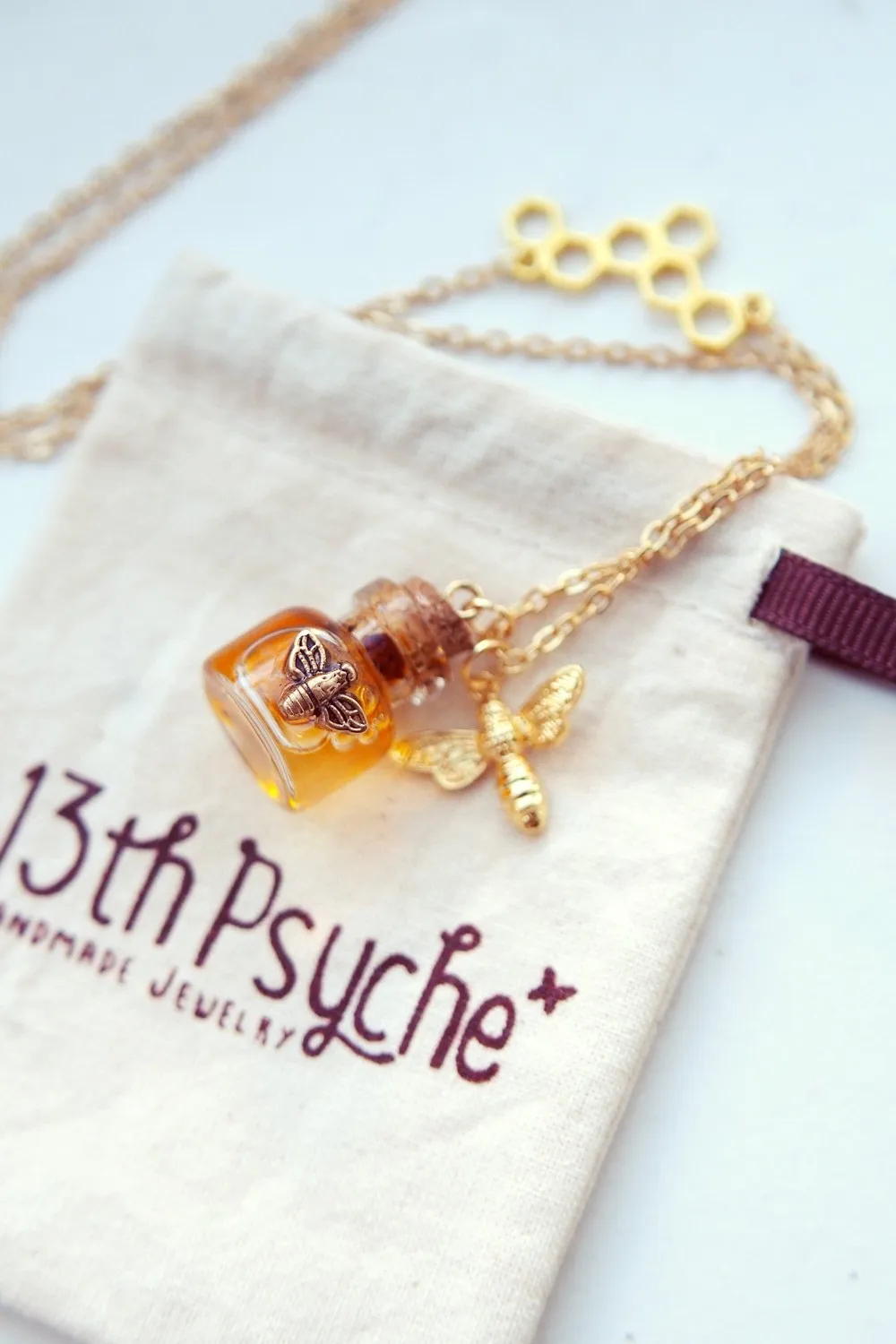 Honey bee and honeycomb bottle necklace