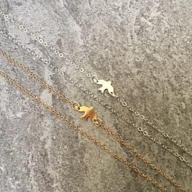 SHORT GOLD DELICATE FLYING BIRD CHARM NECKLACE